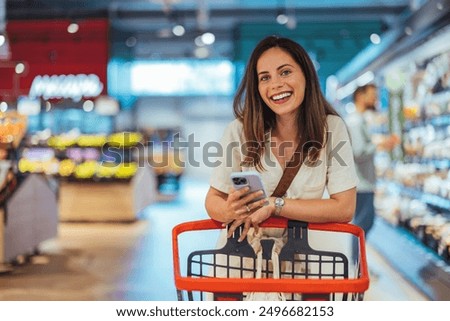 Similar – Image, Stock Photo Shopping cart with a blank mobile phone over a pastel pink background, e commerce, online buying, online commerce, background, technology, shopping day, black friday and network, copy space, mock up