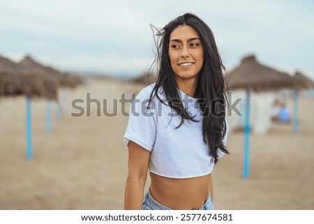 Similar – Image, Stock Photo Crop woman on sandy beach during vacation