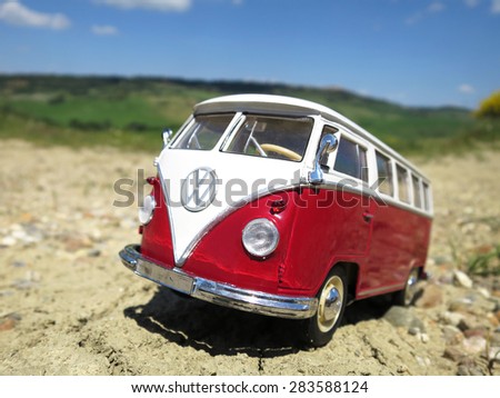 ALSACE, FRANCE - MAY 29, 2015: Miniature VW Bulli 1962 on the rural road. The cult car of the Hippie generation and it remained the status vehicle of the high wave surfers.