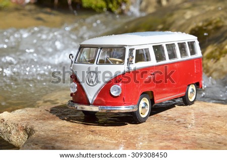 Miniature VW Bulli 1962 in the forest. The cult car of the Hippie generation and it remained the status vehicle of the high wave surfers