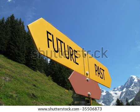 FUTURE - PAST sign against alpine scenery