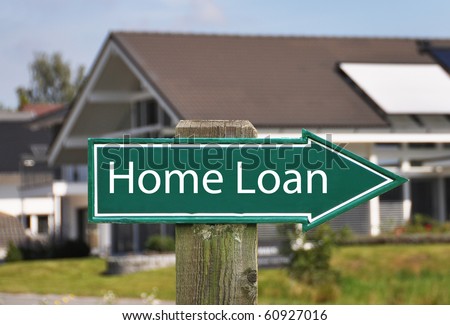 HOME LOAN sign against a house