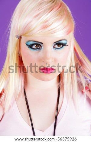 Young white hair girl in a studio isolated on a purple background.