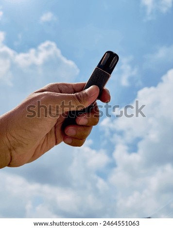 Similar – Image, Stock Photo Hand holding a cigarette