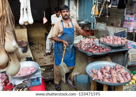 RAWALPINDI, PAKISTAN - JULY 16: Unidentified Pakistani man sells meat at Raja Bazaar on July 16, 2011 in Rawalpindi, Pakistan. Raja Bazaar is the main shopping area in Rawalpindi.