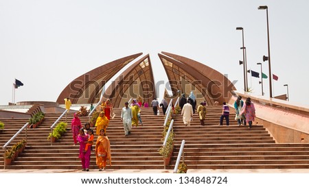 ISLAMABAD - JULY 16: Tourists visit the Pakistan Monument on July 16, 2011 in Islamabad. The monument represents Pakistan\'s progress as a developing country, its provinces and its territories.