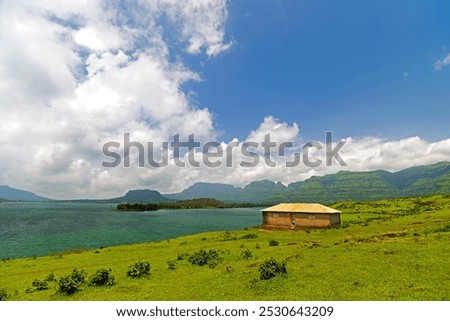 Similar – Image, Stock Photo Cloud drama and lakeside with reflection in moor lake