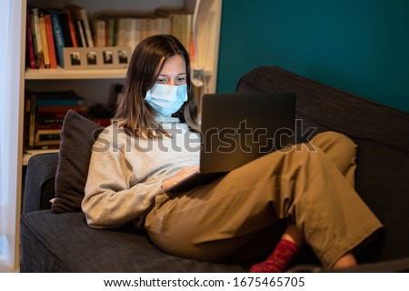 A white girl is working from home during Coronavirus or Covid-19 quarantine, coronavirus covid 19 infected patient in coronavirus covid 19 quarantine room using computer