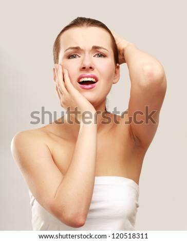 Woman holds head with pain , isolated on white background
