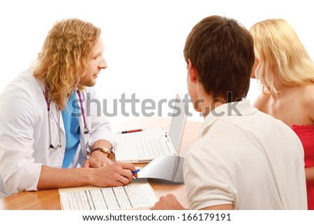 Young couple consulting with doctor isolated on white