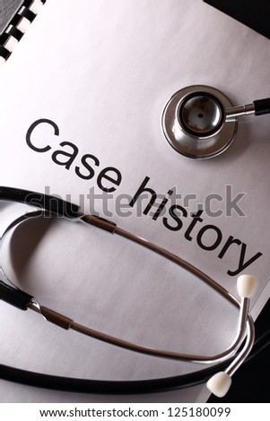Case history and stethoscope on black
