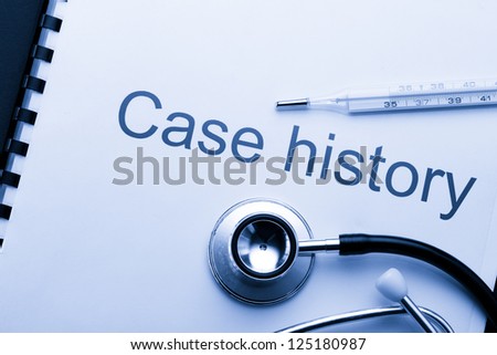 Case history, stethoscope and thermometer on black
