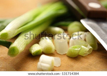 Chopped spring onions on preparation table
