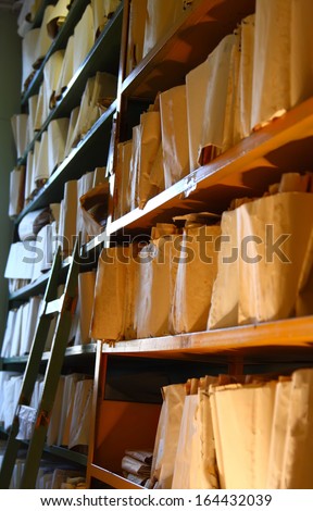 Shelves with paper document in archive