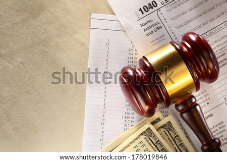 Annual budget, tax form, gavel and dollars