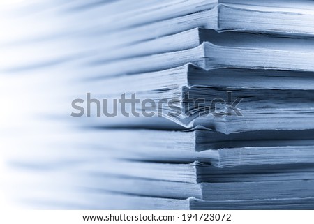 Stack of old magazines as background