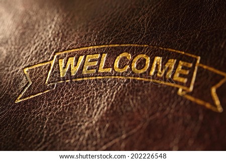 Welcome greeting on leather background