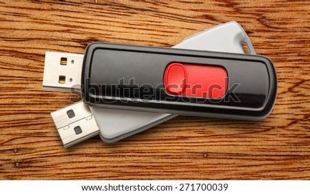 Usb flash drives on the wooden background