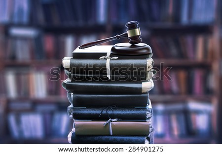 Stack of old paper folders and gavel