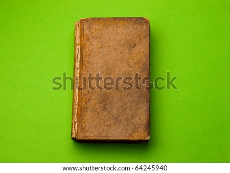 Old book isolated on green
