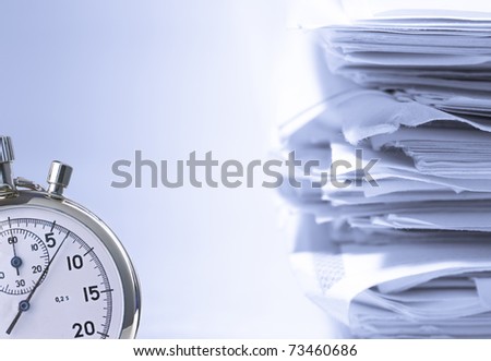 Stack of papers and stopwatch