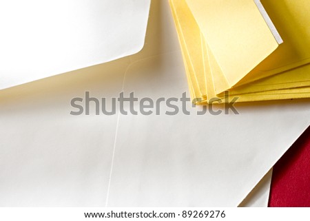 A pile of envelopes on the red background