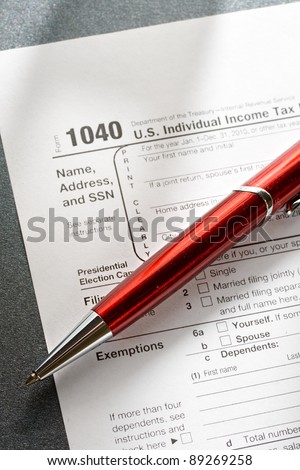 Tax form and a red pen