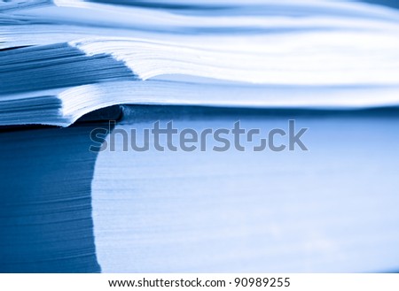A pile of paper and a book