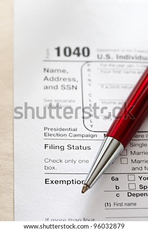 Tax form and a red pen