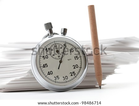 Pile of paper cards with pencil and stopwatch