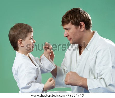 Karate master with his young student