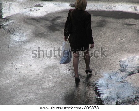 sexy woman strolling after the rain