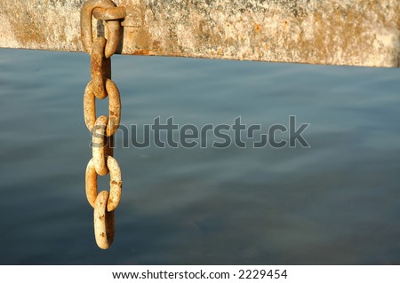 old and rusty chain, detail of industrial construction on the river banks
