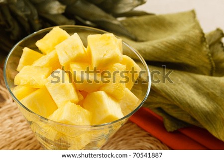 Fresh pineapple chunks served in a contemporary glass bowl
