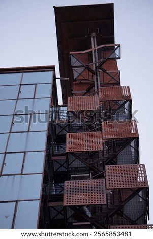 Similar – Image, Stock Photo Tower made of glass, internal stairs, many people on the steps, light blue sky, building complex connects to the tower, steel construction