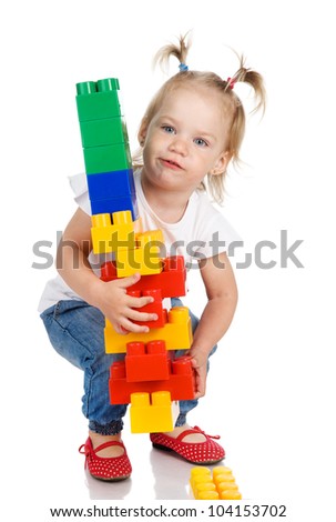 baby girl build house. Isolated on a white background. Concept of building and purchase of the house.