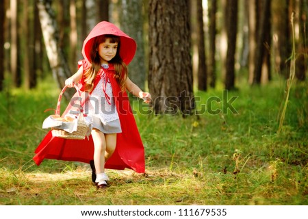 the girl runs on the wood.  the fairy tale \