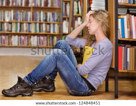 sad student in library