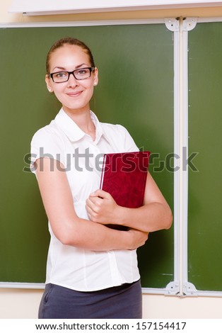 portrait of young teacher with book
