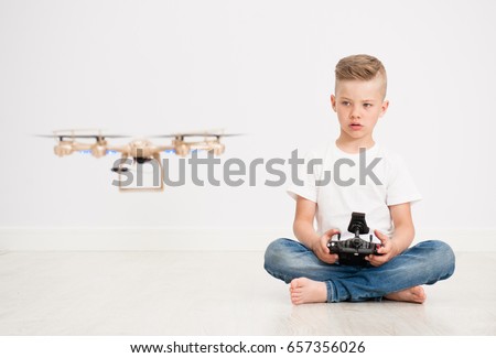 Similar – Image, Stock Photo Little kid operating drone in field