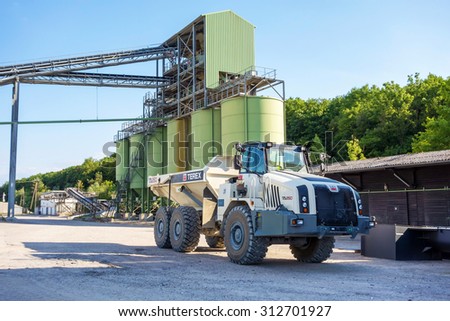 Hagenbach, Germany - May 31, 2014: Large Volvo Terex Truck TA 250 in open pit mining and processing plant for crushed stone, sand and gravel at polder Daxlander Au