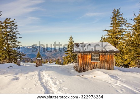 Mountain cabin in the woods - winter landscape
