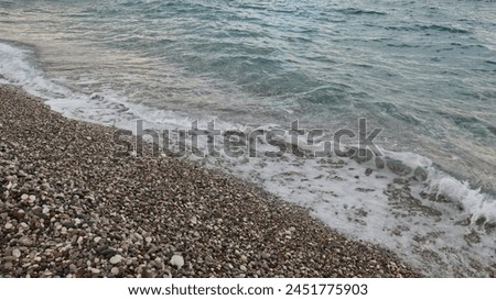 Similar – Image, Stock Photo Stony seashore and waves at beautiful sunset