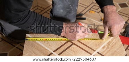 Similar – Image, Stock Photo Workman with measuring tape making surf board
