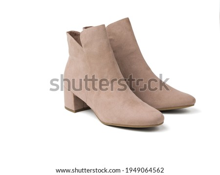 Image, Stock Photo Woman in brown boots standing on a wooden floor holding a dried artichoke flower in her hand