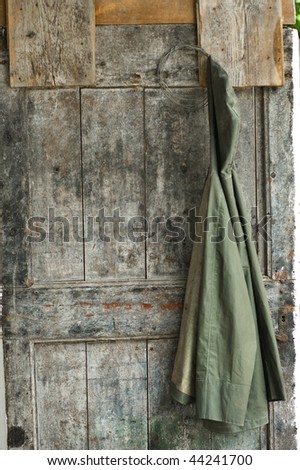 Jacket hanging on an old wooden door