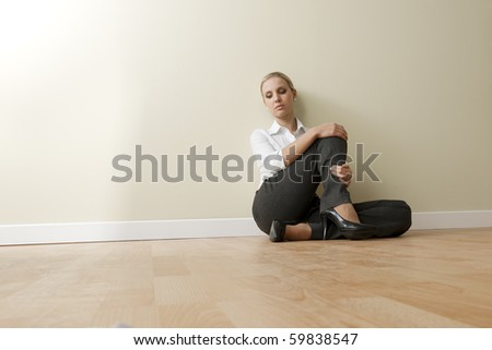 Bored/Tired businesswoman sitting on the floor