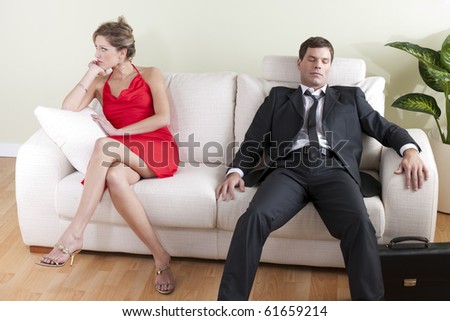 Tired man on sofa, disappointed woman ready to go out
