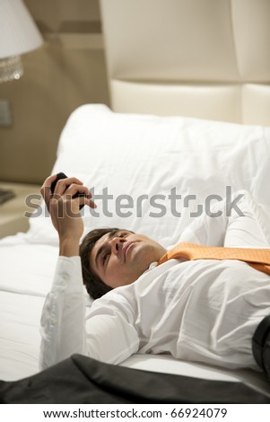 Tired Businessman resting in hotel room