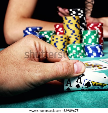 hands holding a deck of playing cards